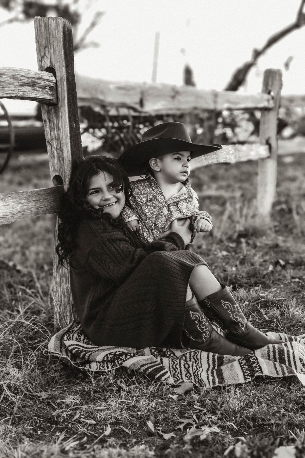 Black and white photos of people relaxing on a blanket outdoors in casual poses.