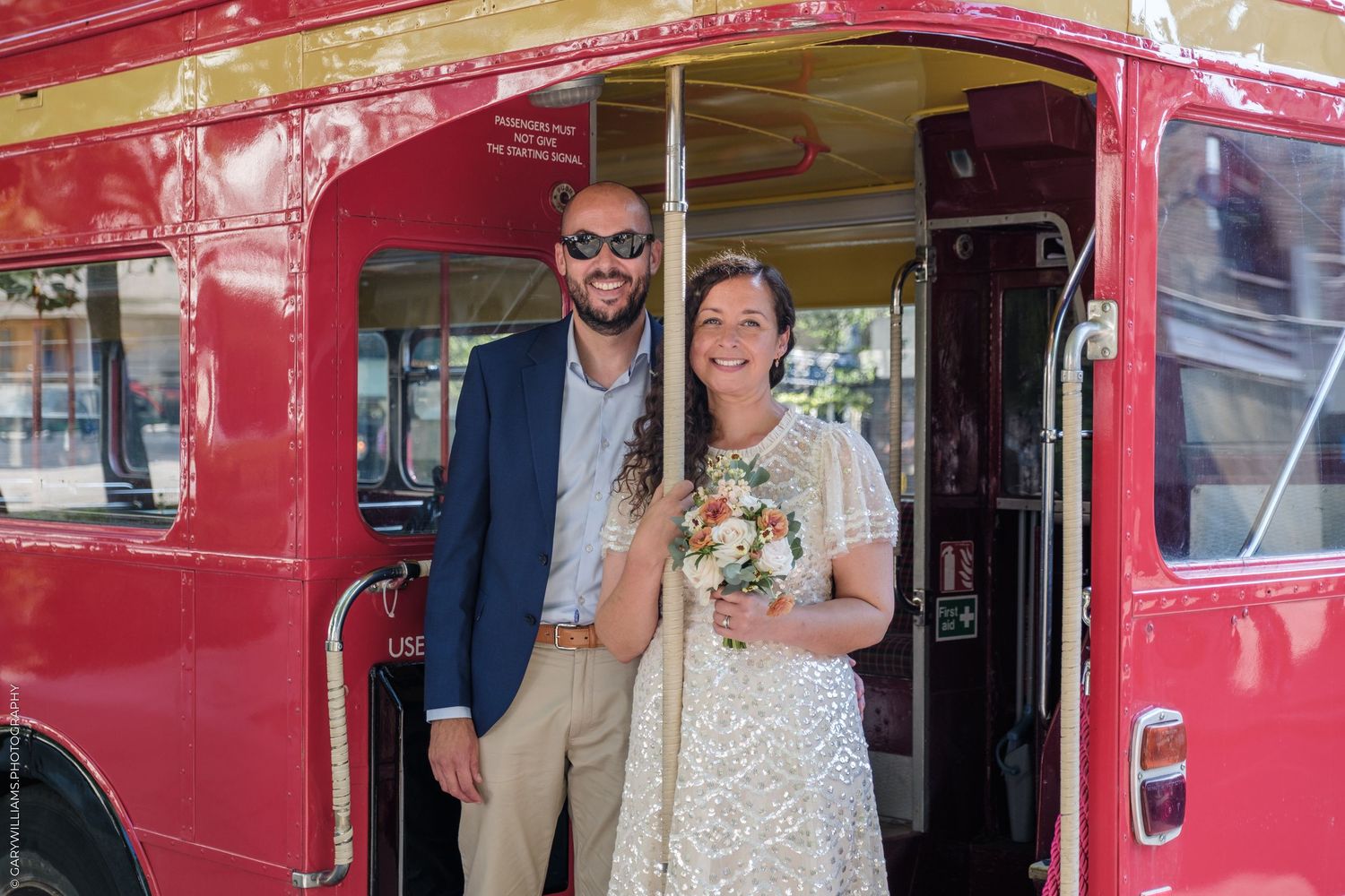 Vintage red double decker bus decorated for a special occasion.