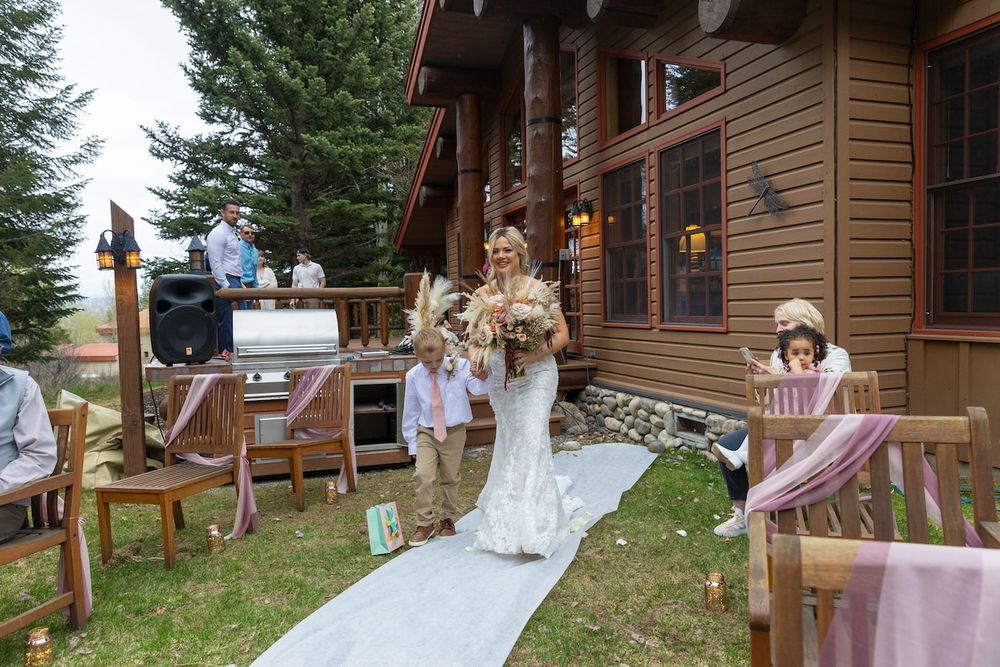 bride in her wedding dress during her backyard wedding