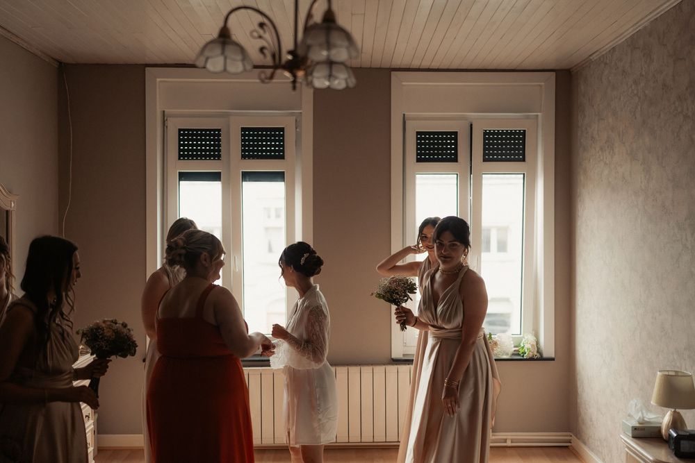 A couple dances intimately in a sunlit room with multiple exposures creating a dreamy effect.