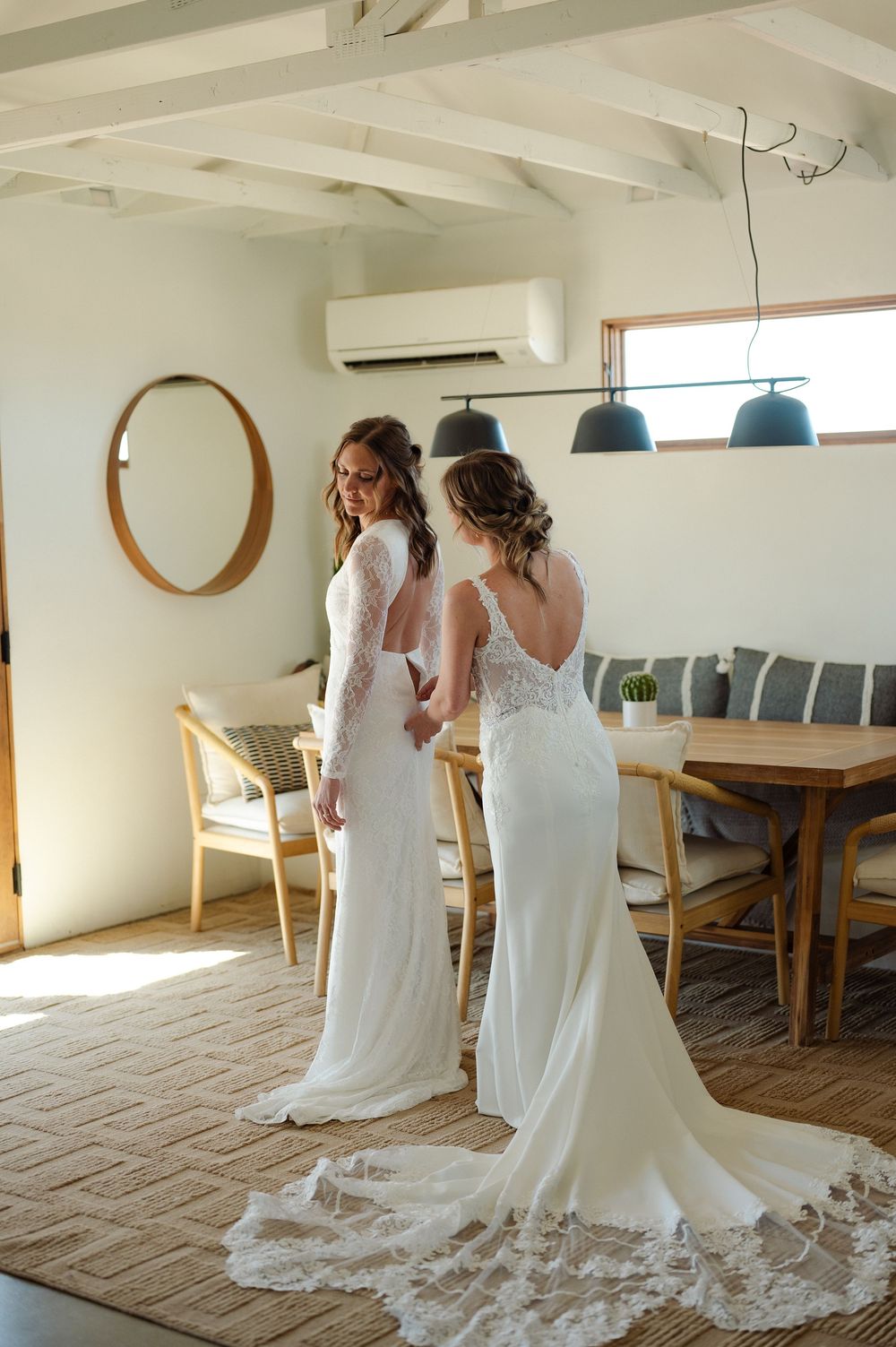 lgbtq brides helping each other getting ready in Joshua Tree desert