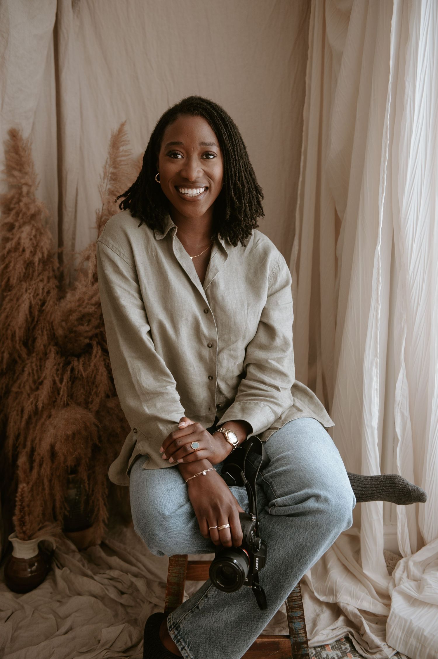 Black female photographer specialising in maternity, newborn and family photography