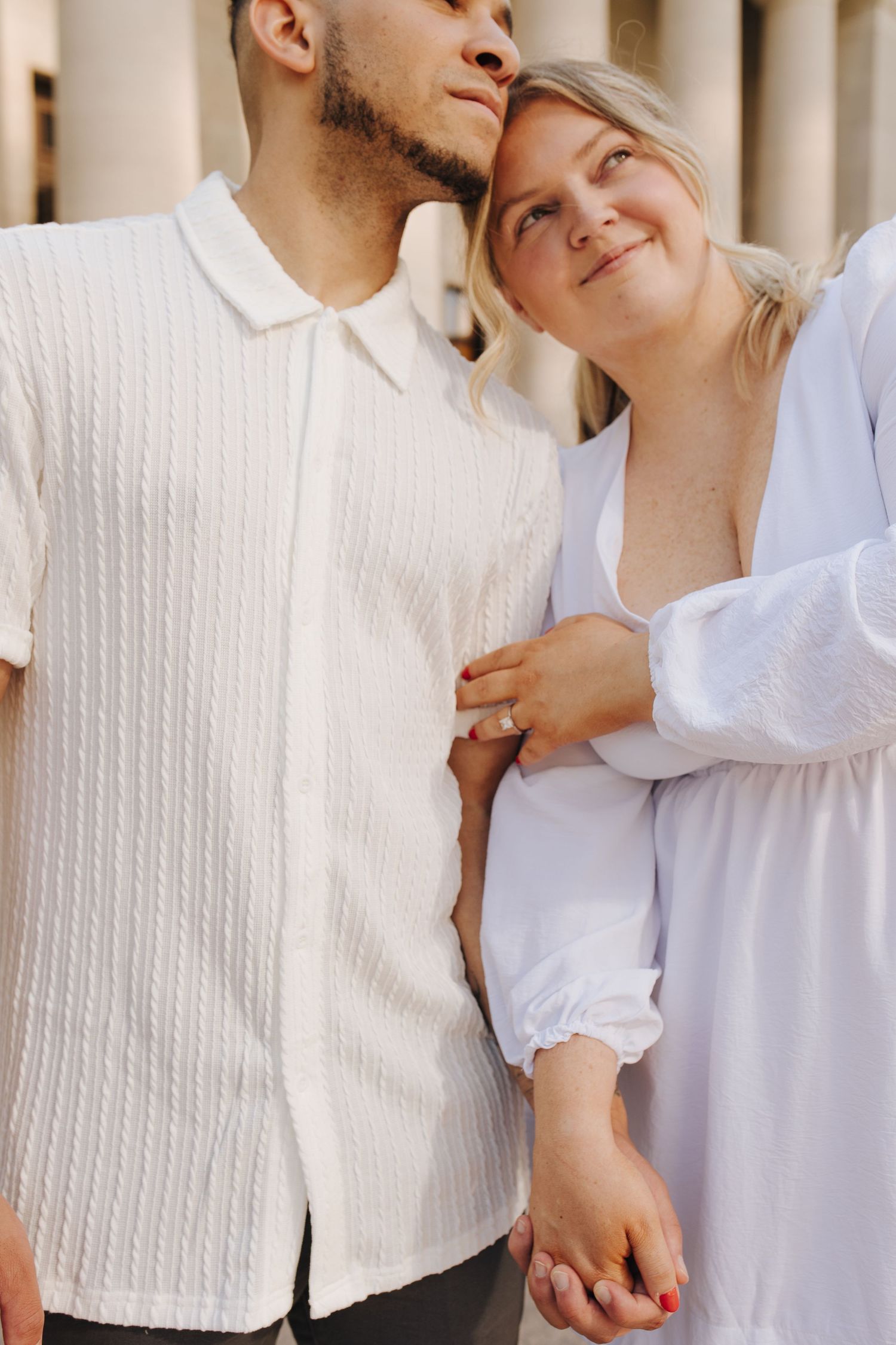 Romantic close-up of groom-to-be leaning into bride-to-be during engagement session in Columbus, Ohio.