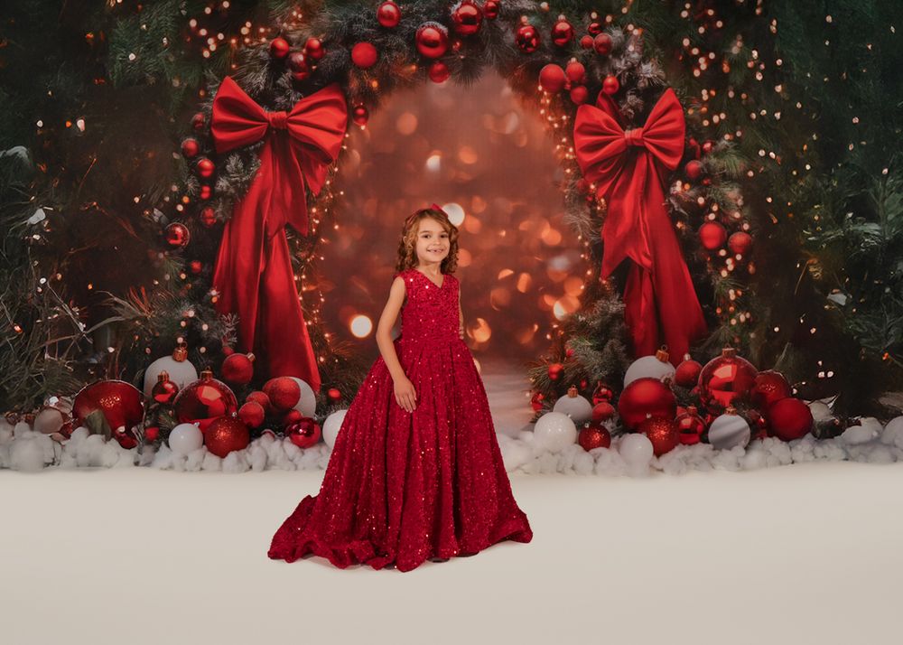 A collection of red Christmas-themed photos featuring festive decorations, bows, and elegant dresses in a snowy setting.