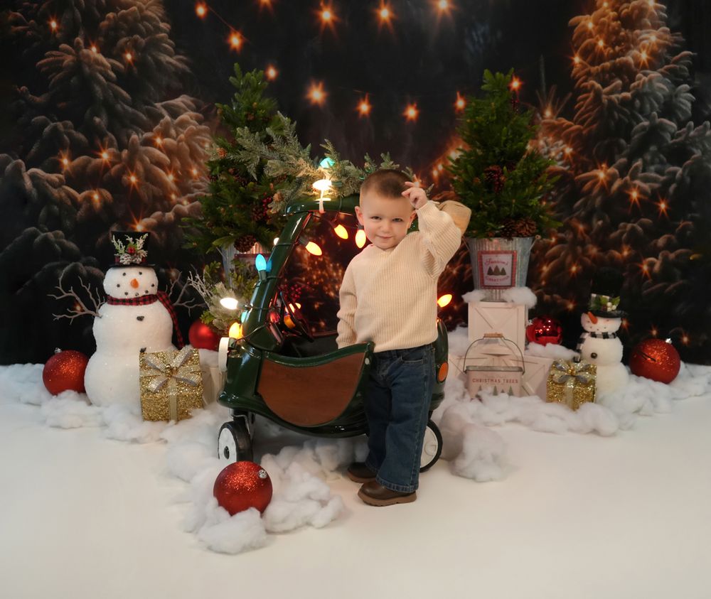 A cozy holiday scene featuring illuminated string lights, decorative snowmen, and red baubles set in a winter wonderland setting.