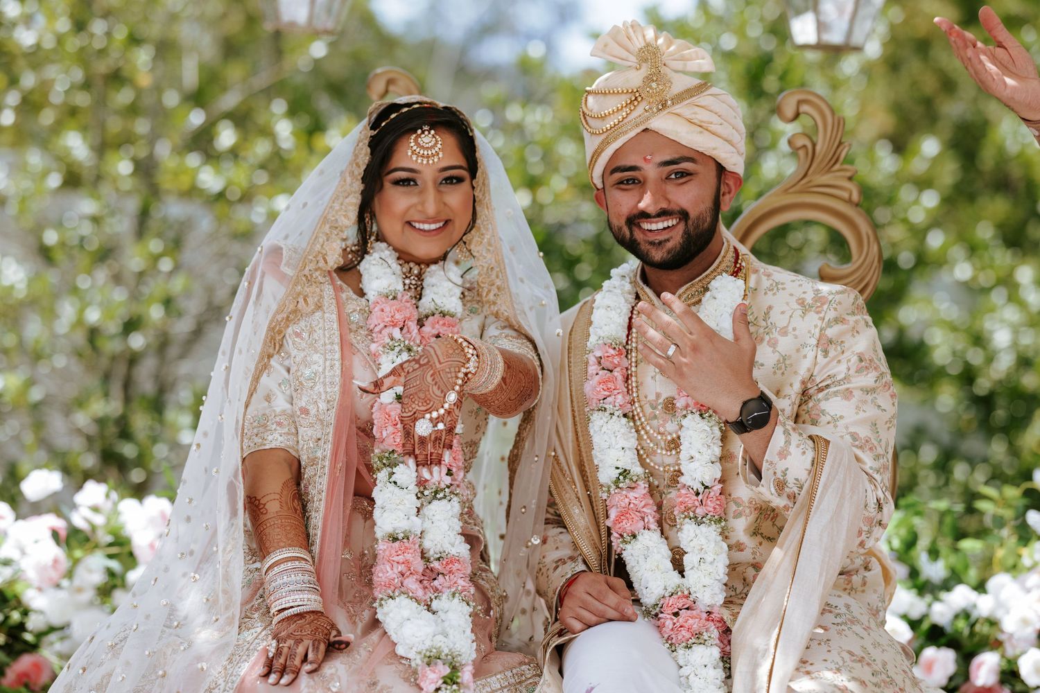 Radiant couple in traditional attire celebrates their wedding at Hanover Marriott, NJ—perfect blend of elegance and culture.