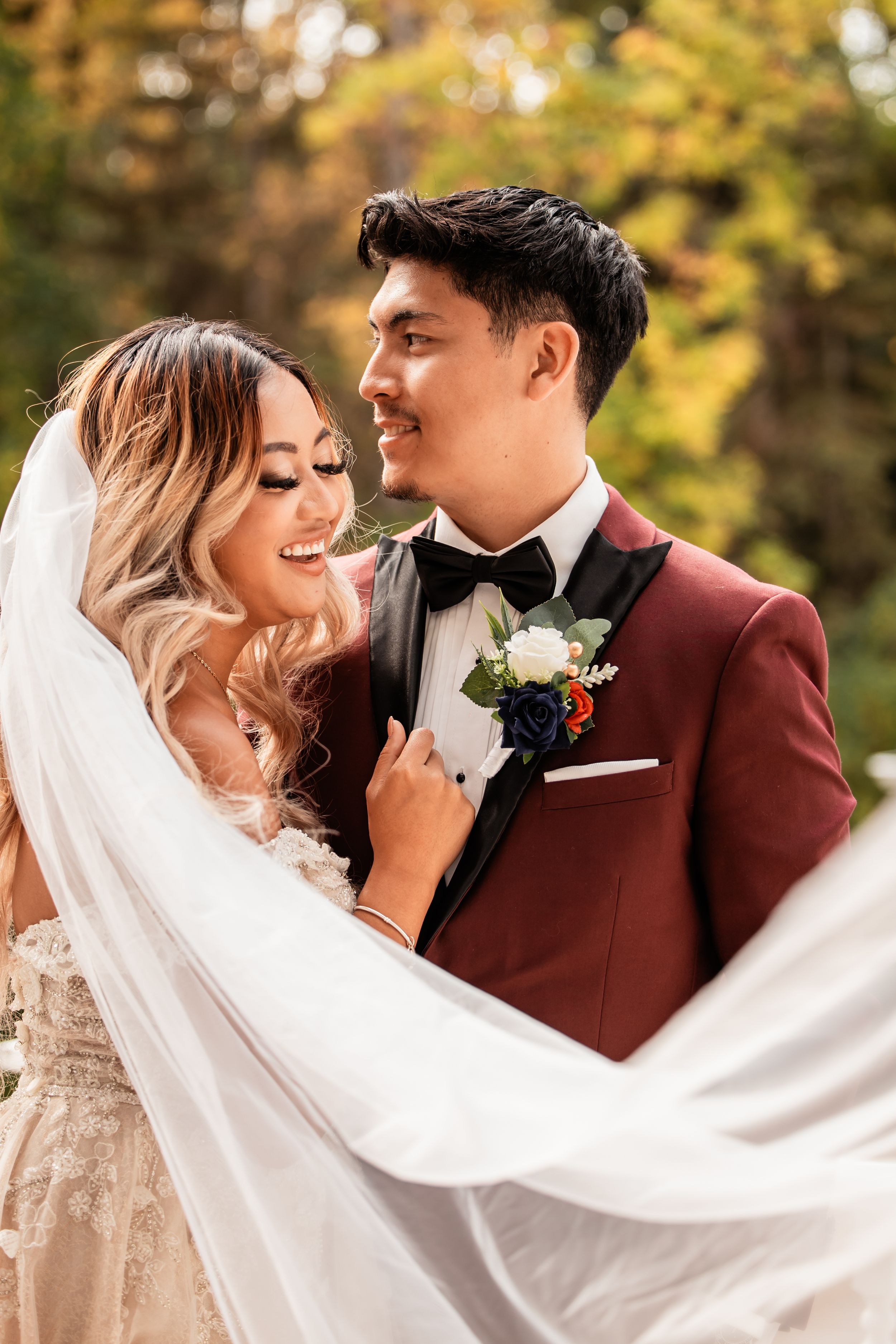 couple shot where bride is giving a beautiful laugh