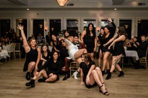 bride and her bridemaids after their dance at the reception