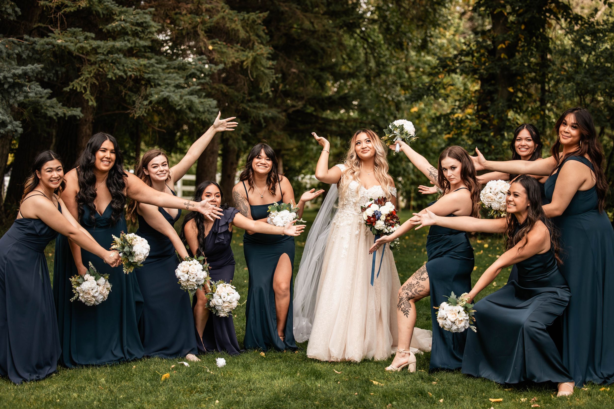 bridemaids showing off the bride