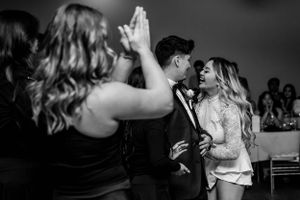 bride and groom dancing happily