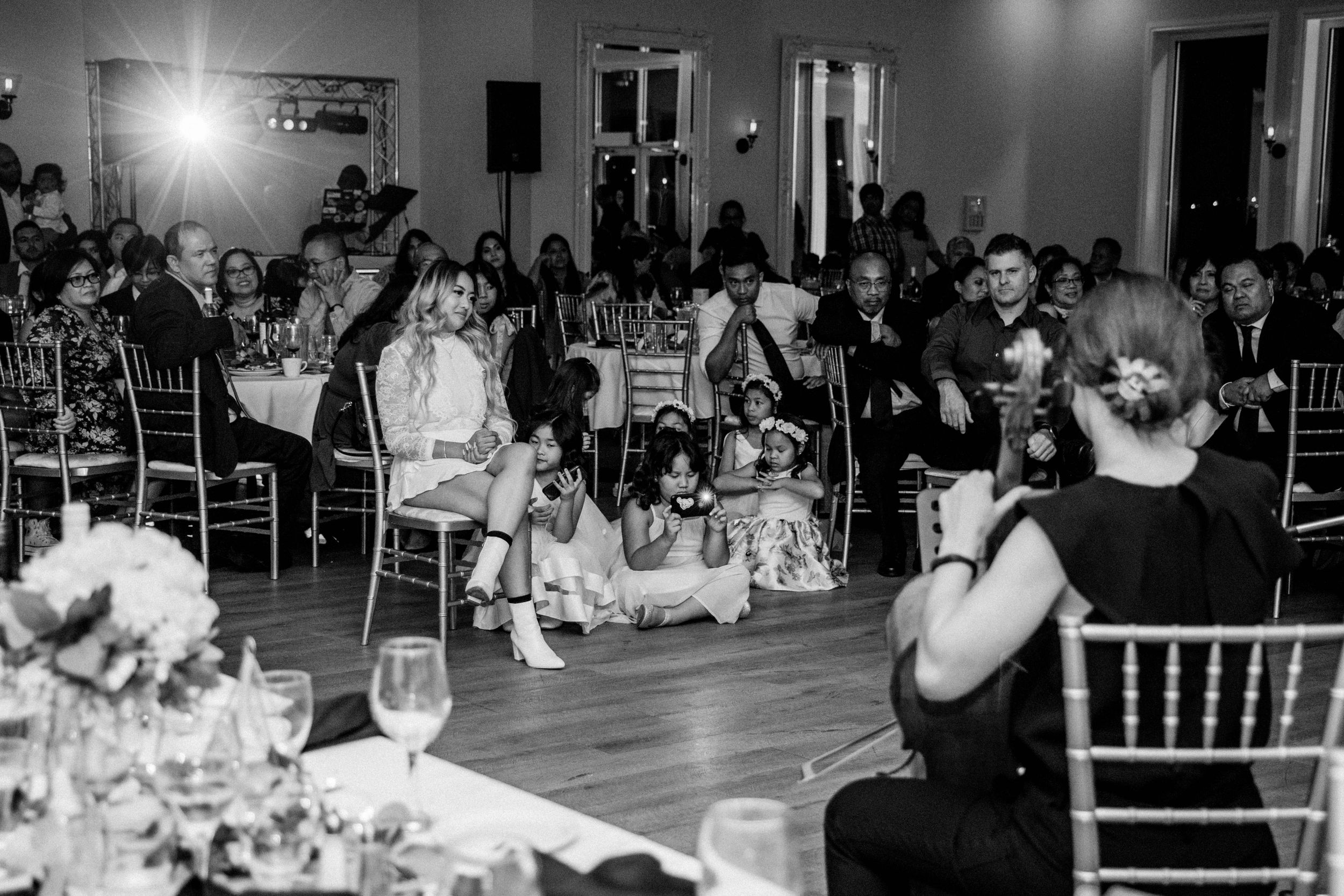 Bride watching groom sign a song for her