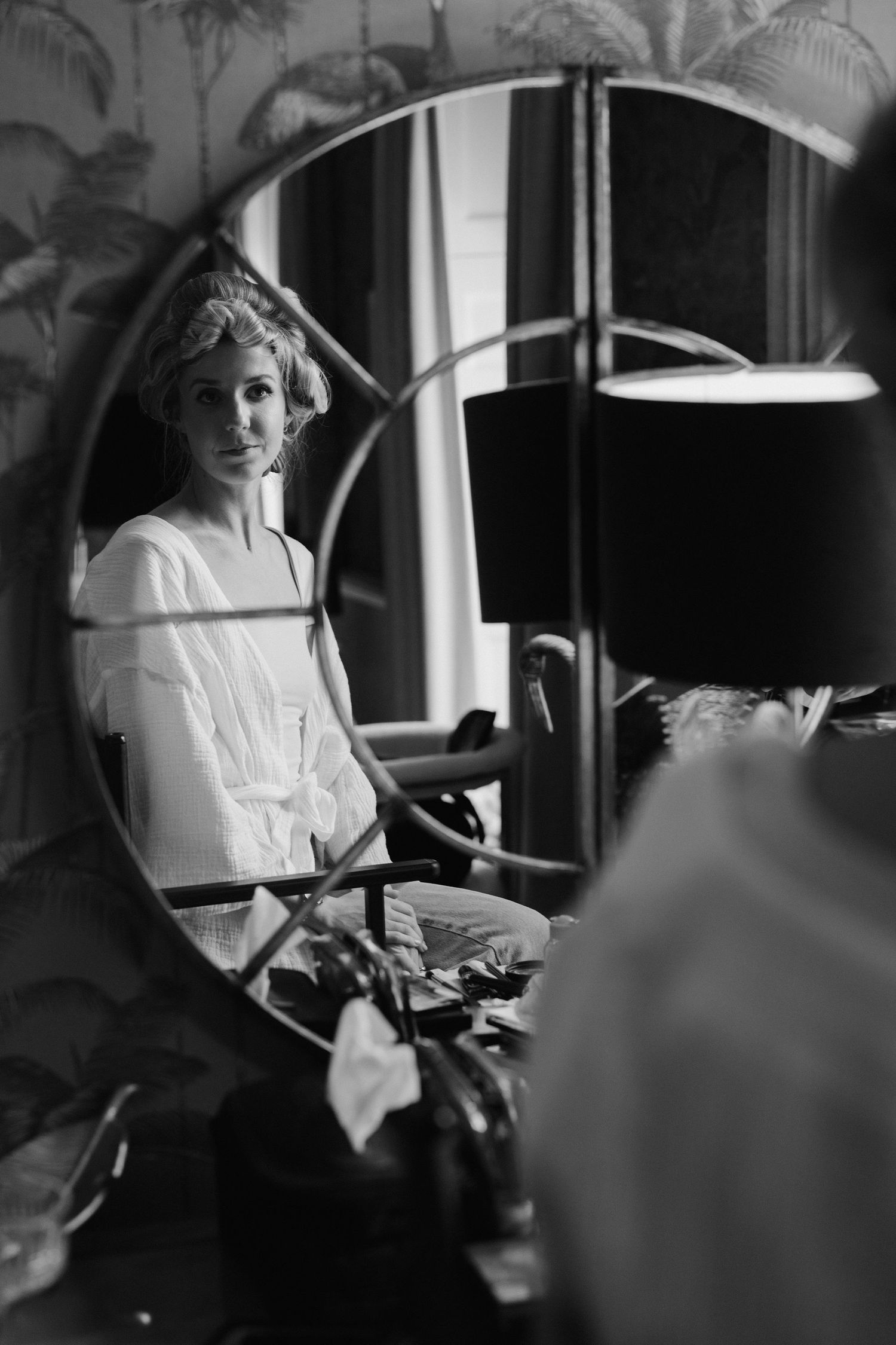 bride looking in mirror while getting ready at the Queensbury hotel in bath