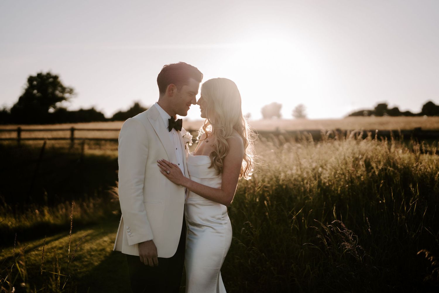 bride and groom looking into each others eyes during sunset at hamswell house wedding in bath