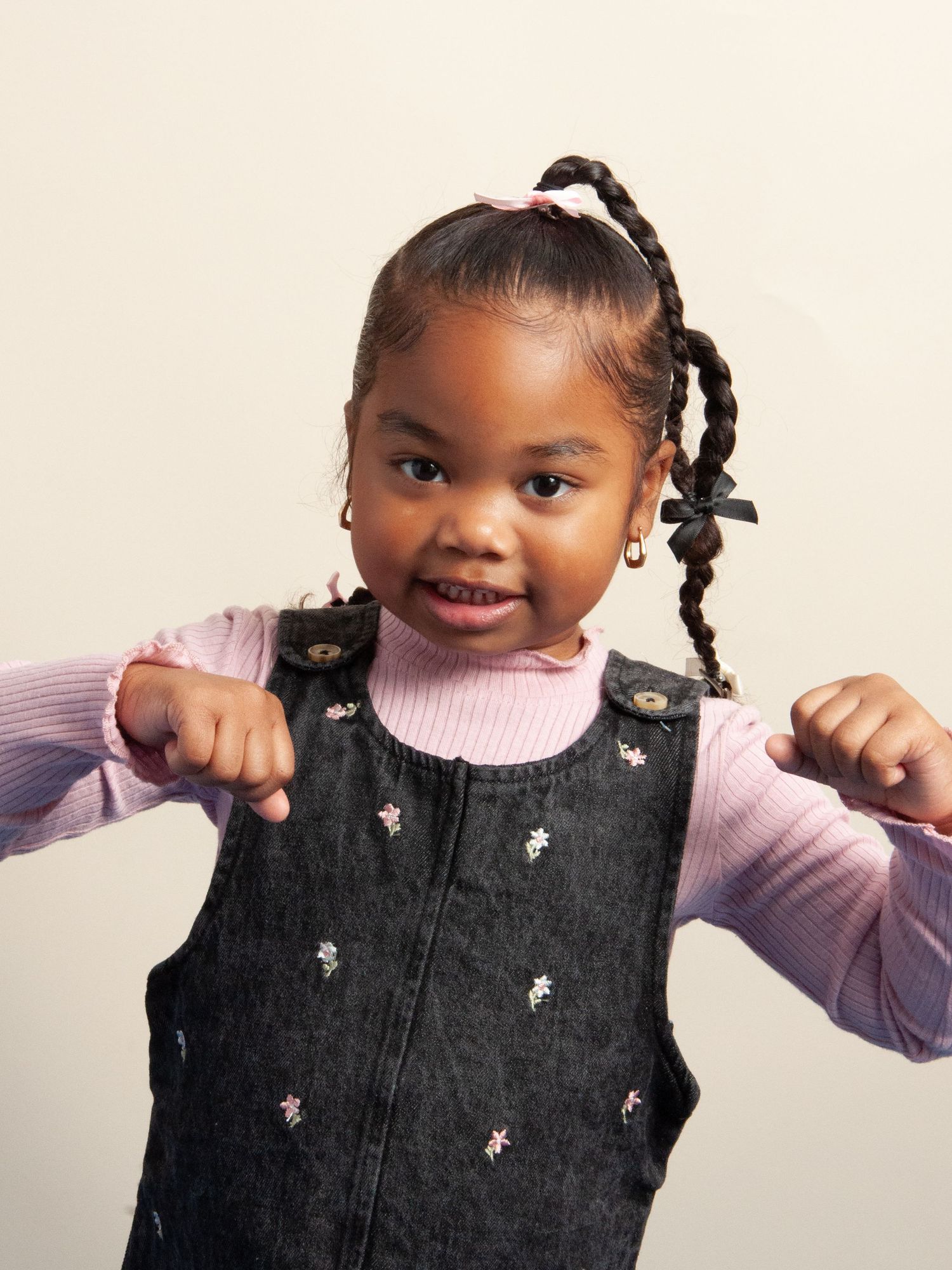 A bright and expressive studio portrait of a child, capturing personality and charm in a professional photography session.