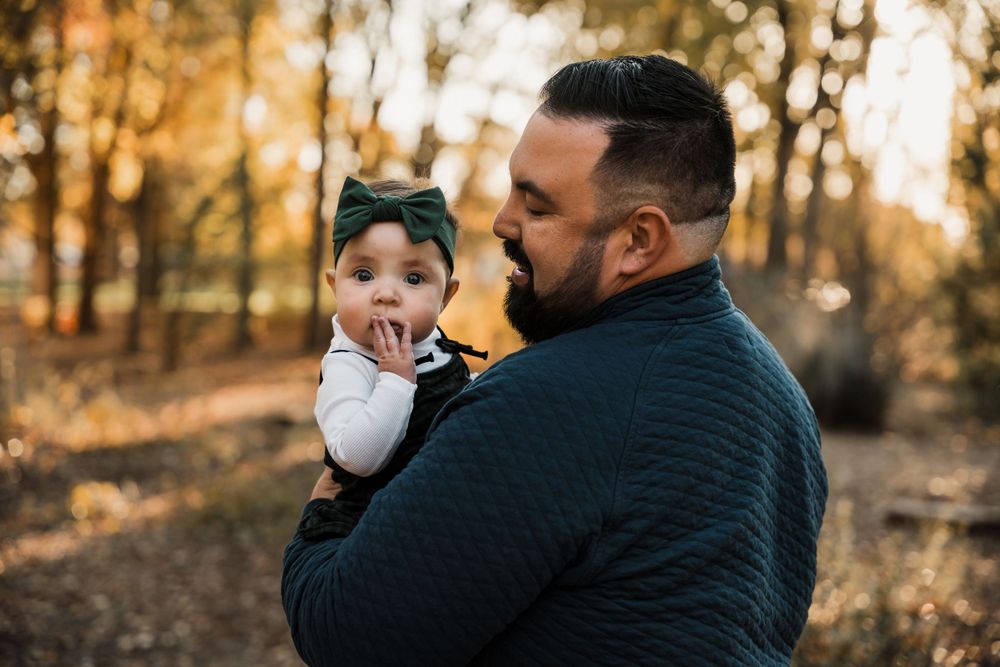 Family photoshoot sequence showing loving interactions against a sunset forest backdrop.