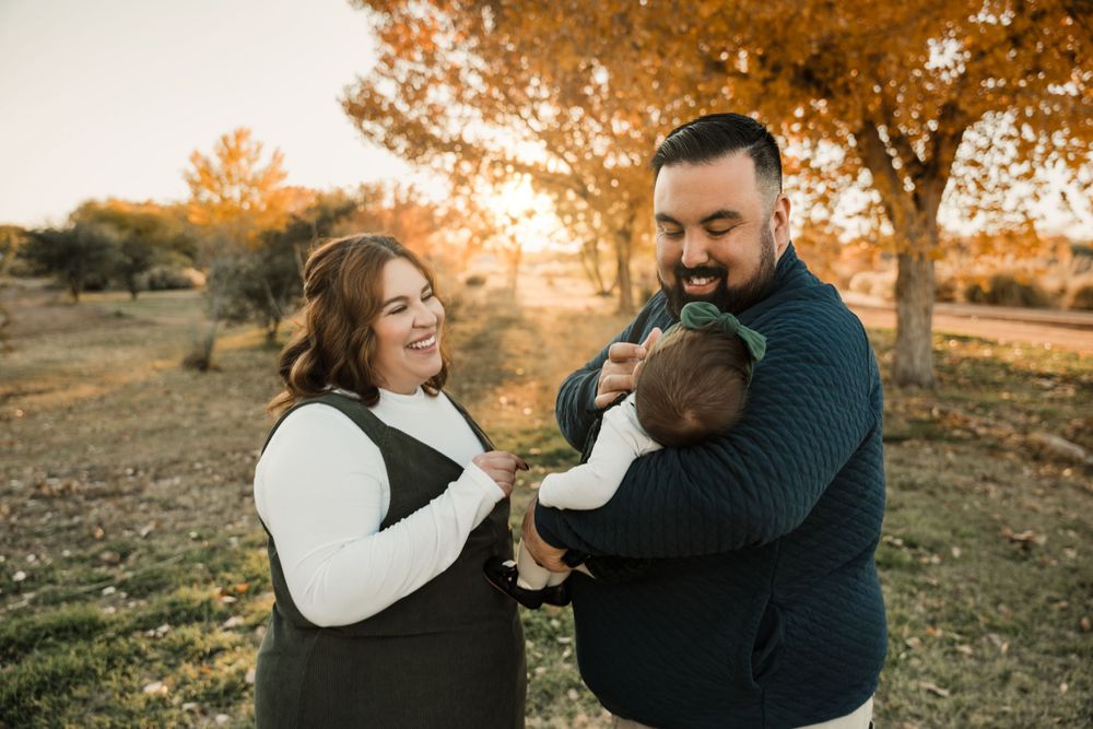 Natural family photography session featuring candid moments in autumn sunlight.