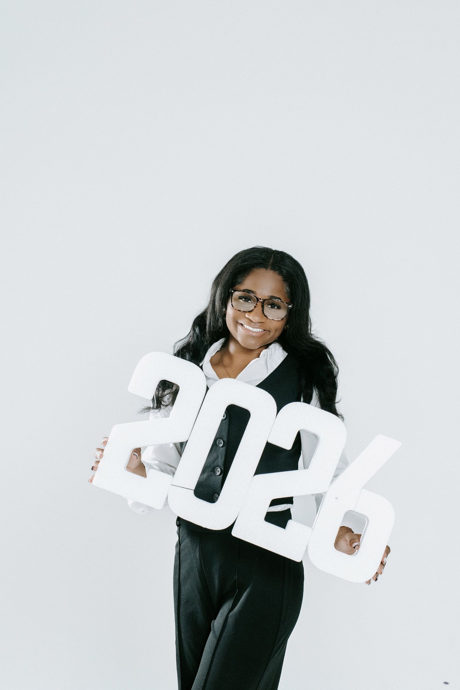 Creative black and white themed portrait session with large dimensional letters.