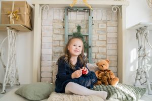 Sweet rustic room setup with plush teddy bears and cozy textures displayed against white brick wall decor.