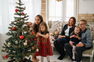 A series of festive holiday photos with a decorated Christmas tree and people in red plaid outfits enjoying the season.