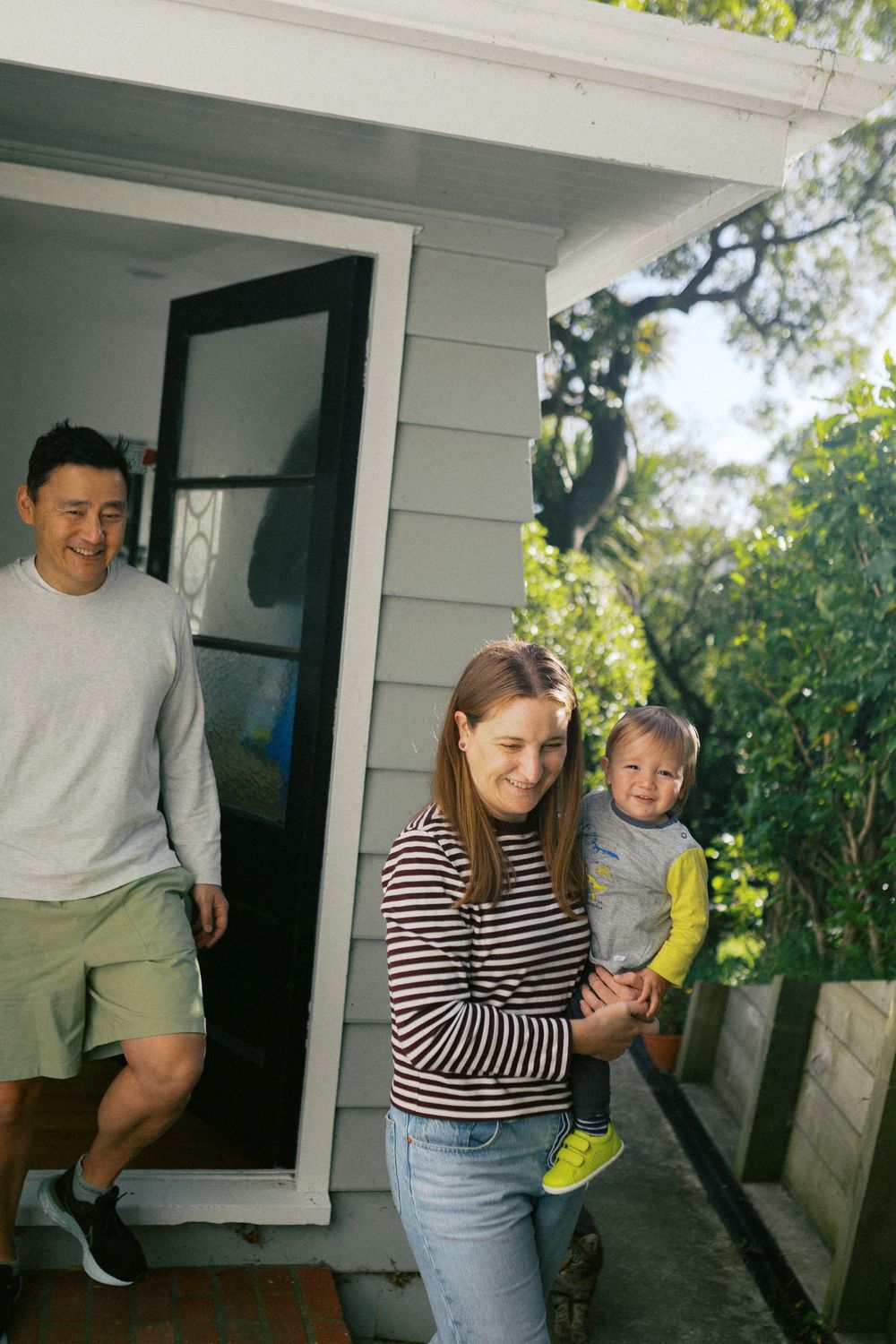 A series of candid family moments captured on a sunny porch with natural lighting.