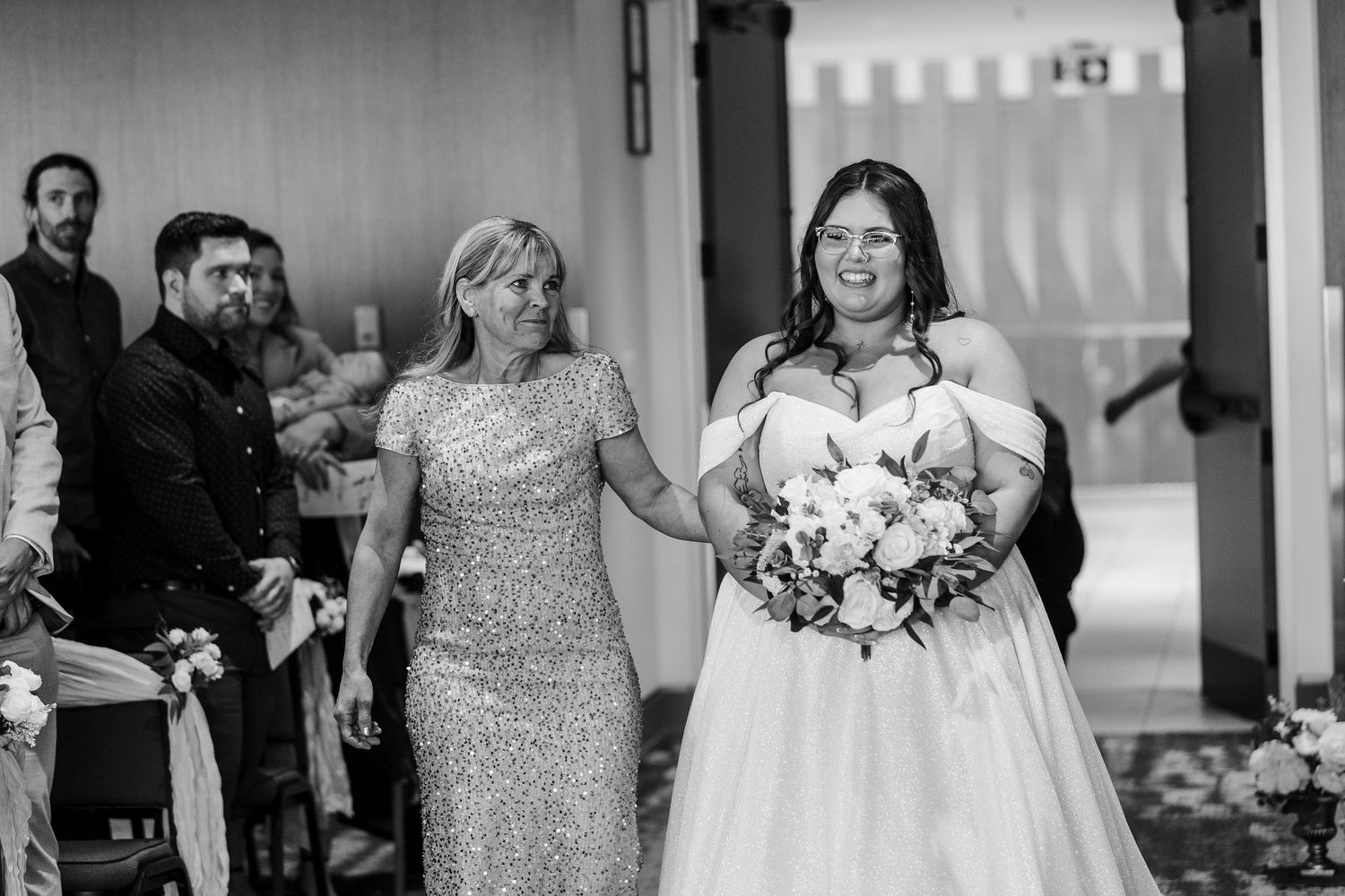 Black and white photo montage of wedding celebration moments showing dancing and celebration at a reception party.