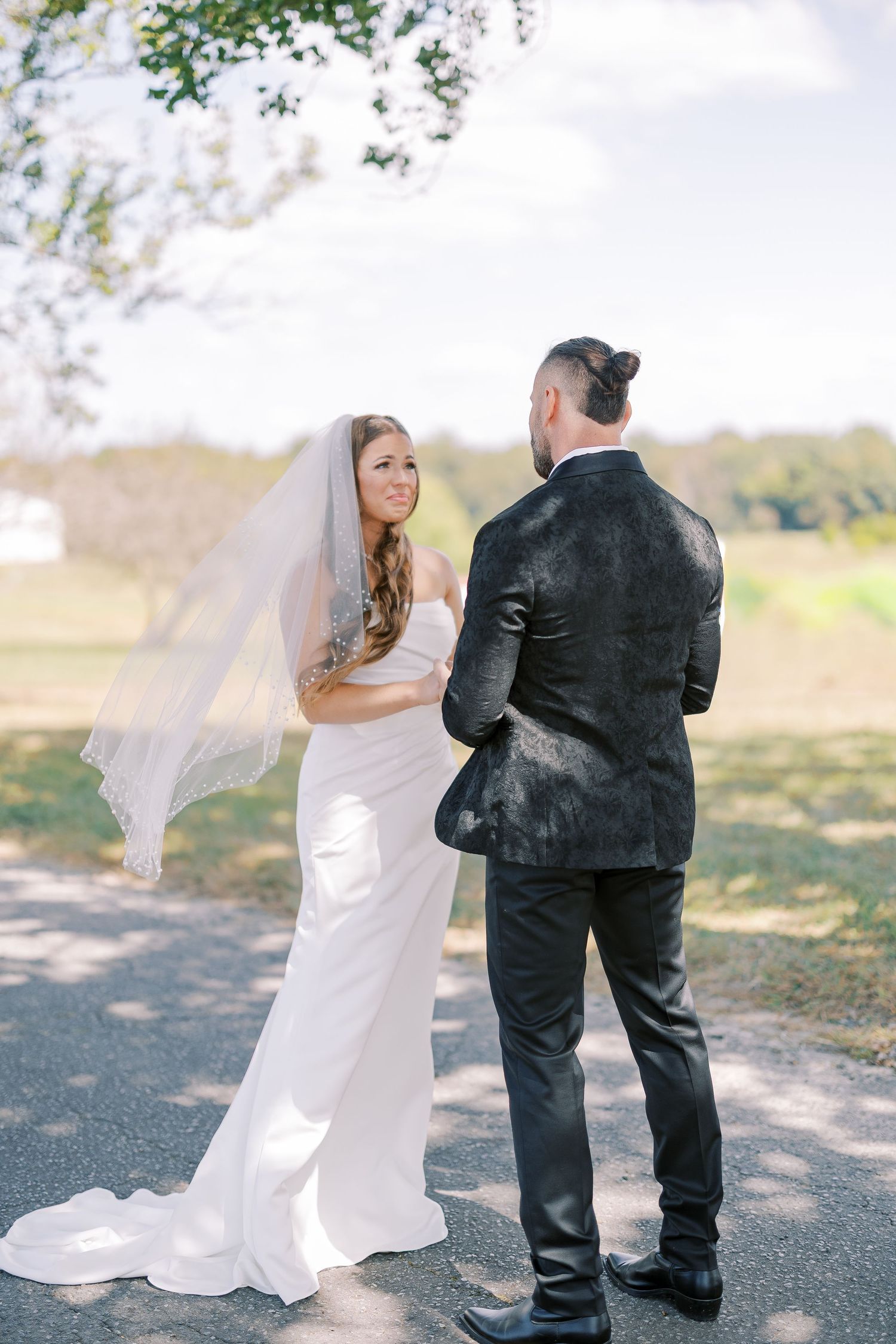 A romantic sequence of wedding photos shows a bride and groom dancing together on a tree-lined path outdoors.