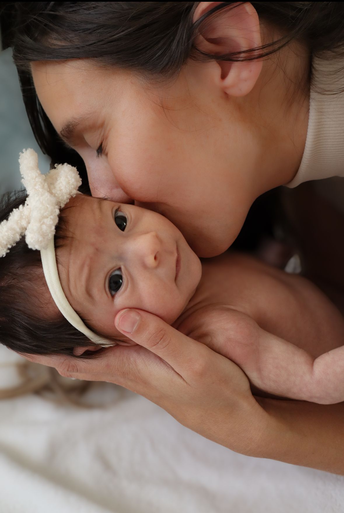 Just a few weeks old and this beautiful mama had pictures taken just in time to show off the tiny details of her babies' fingers and toes.