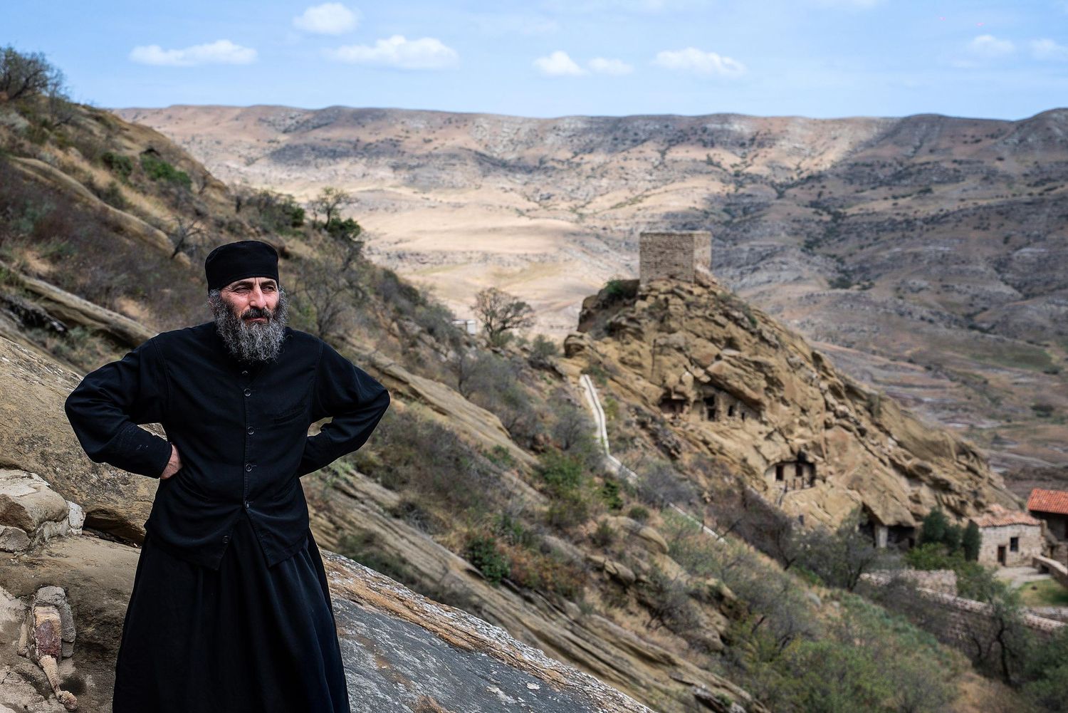 A series of panoramic shots showing rocky desert mountains and cliffs against a blue sky in a scenic landscape.