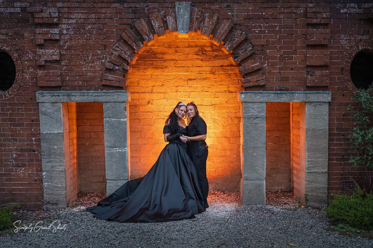 Southcrest Manor Hotel Wedding Photographer captures Holly & Tanysha an LGBTQ+ couple sharing an intimate embrace on their wedding day.