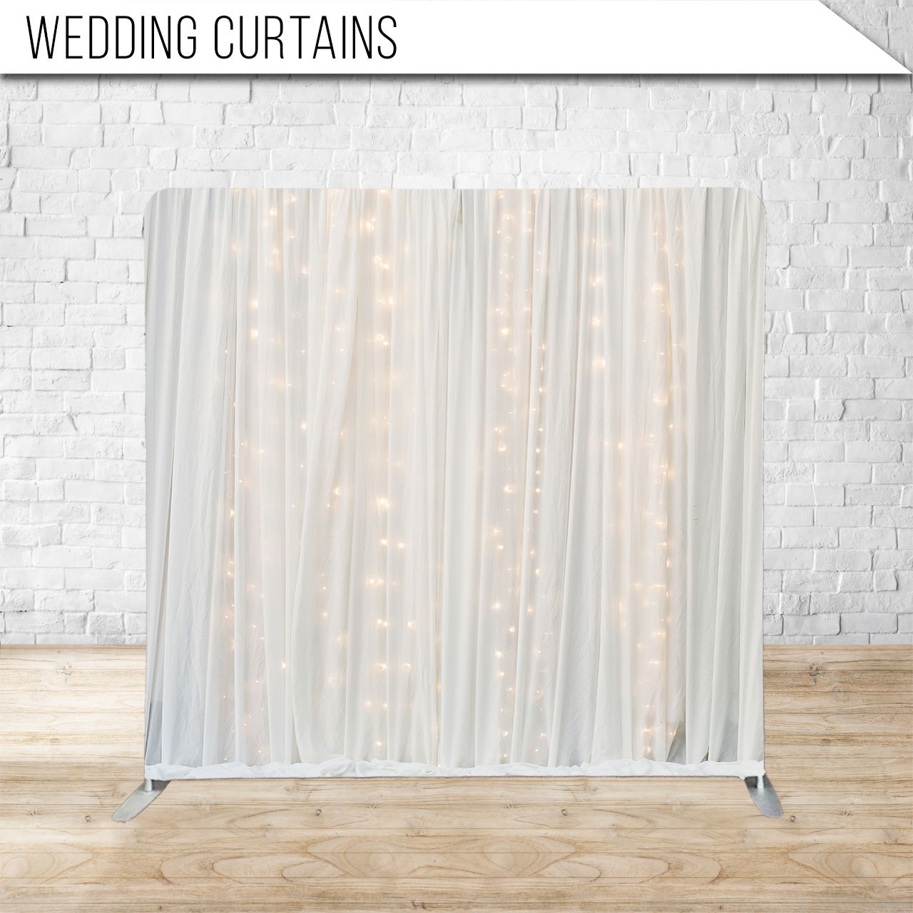 String lights create an elegant cascading curtain effect against a white textured wall with wooden flooring.