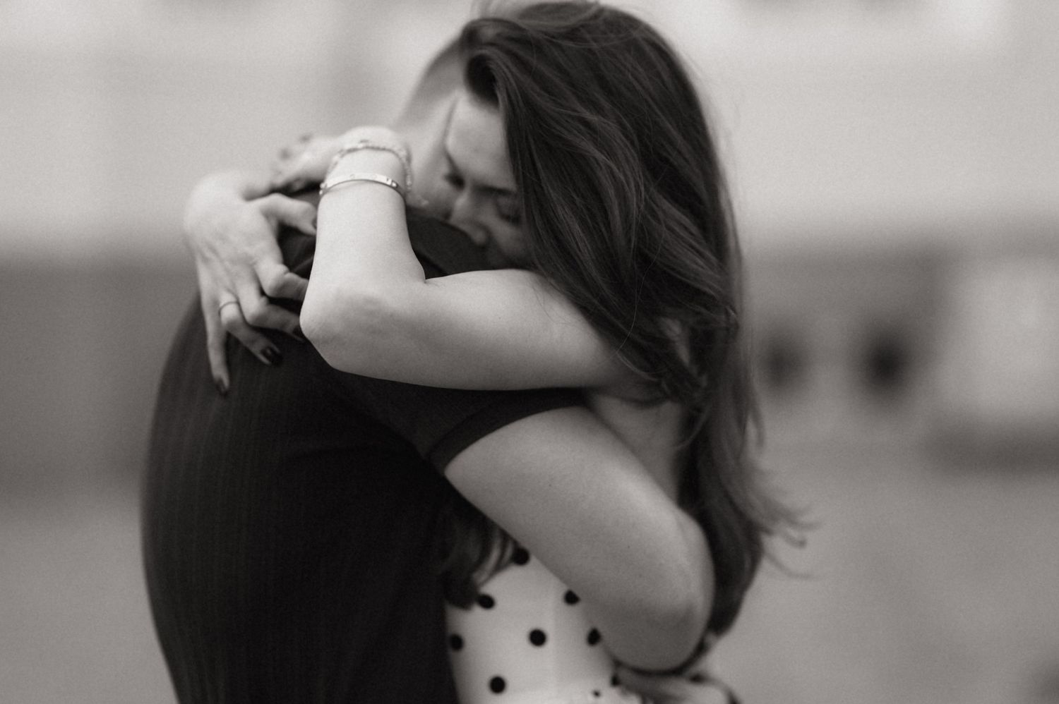 A black and white photo series showing intimate moments of a couple embracing and hugging.