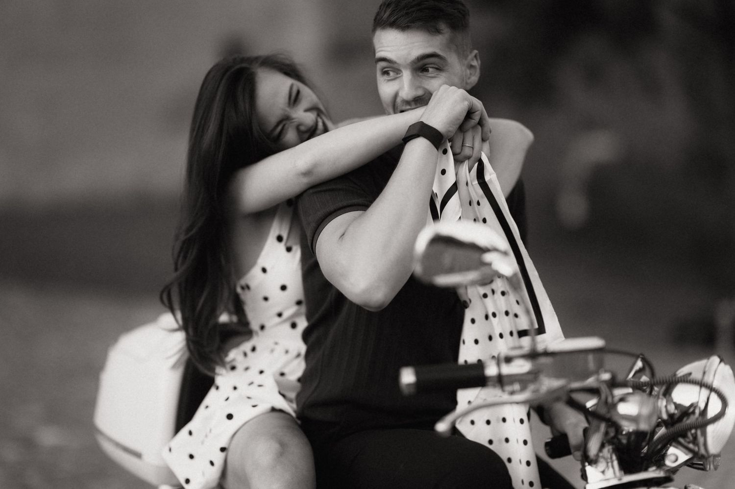 A romantic couple in polka dot outfits shares tender moments in black and white photographs.