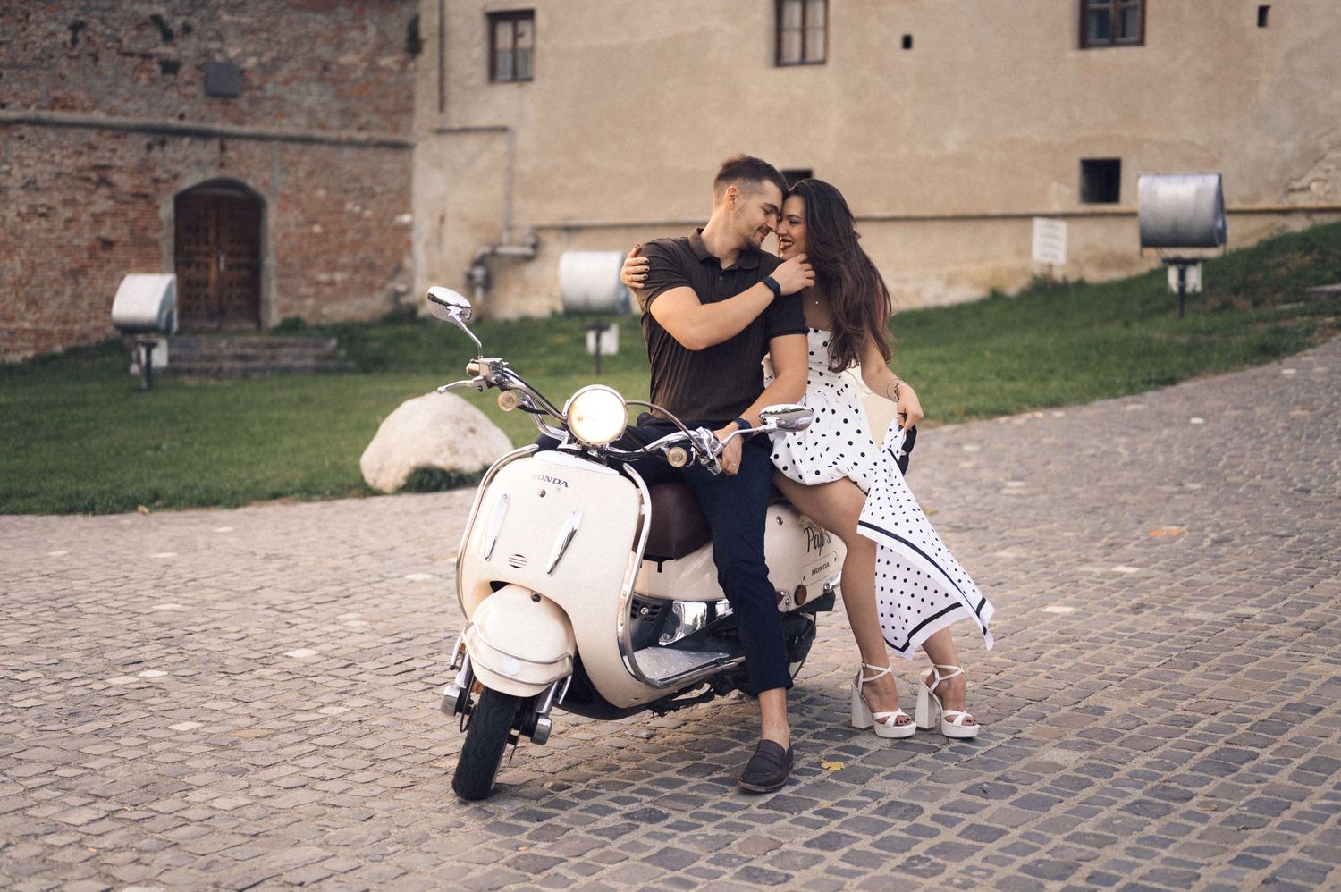 A sequence of five similar photos showing dance moves performed on a cobblestone courtyard.