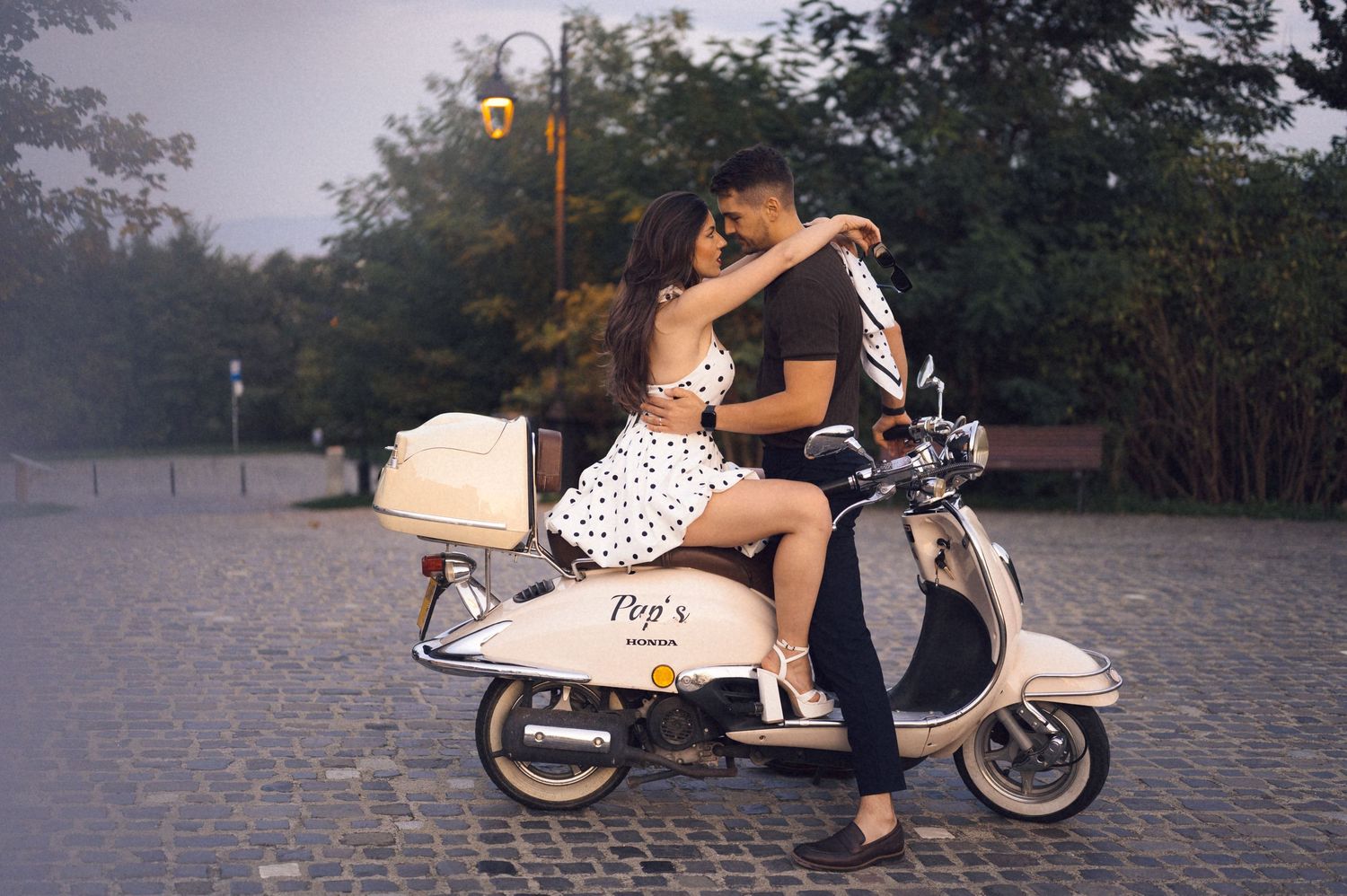 A series of romantic couple photos on a vintage scooter against a misty outdoor backdrop.