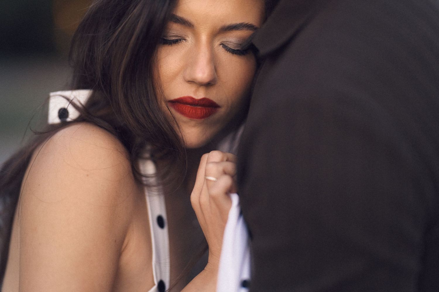A collection of artistic close-up photos showing red lipstick and a silver microphone against dark backgrounds.