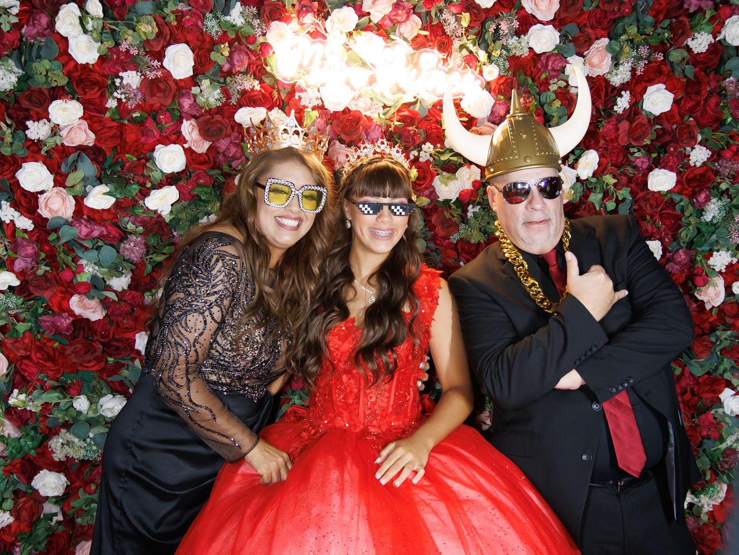 mom and dad with Quinceanera taking photo