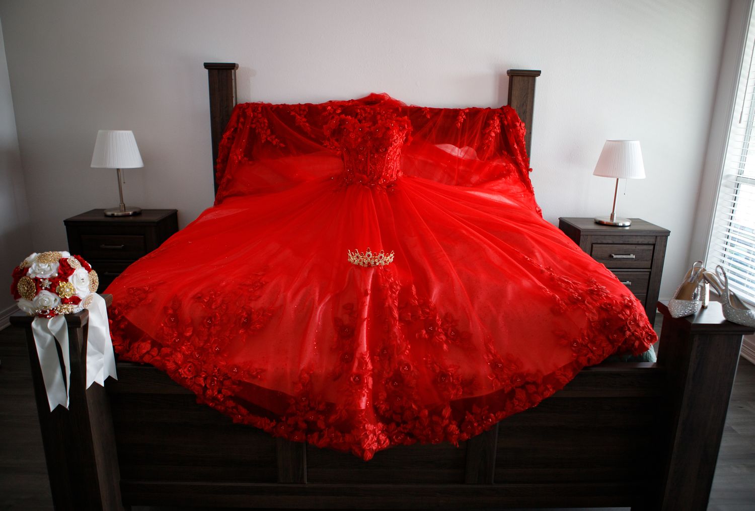 red dress laid on bed Quinceanera