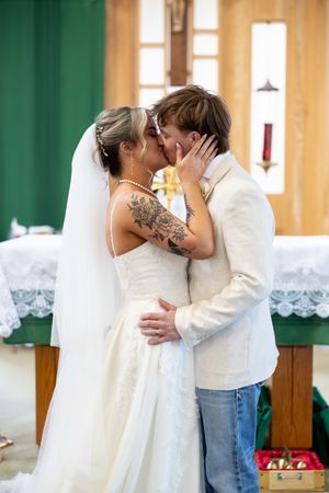 A series of romantic wedding photos showing tender moments between a couple in a church setting.