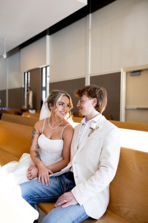 A sequence of intimate wedding portraits showing a couple seated together on wooden church pews.
