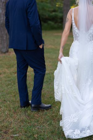 Wedding dress and suit details captured from creative angles in outdoor setting.