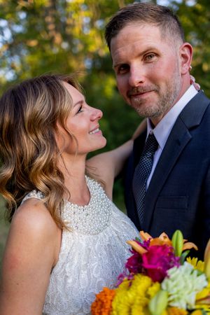 A series of intimate wedding portraits featuring bright floral bouquets and natural outdoor lighting.