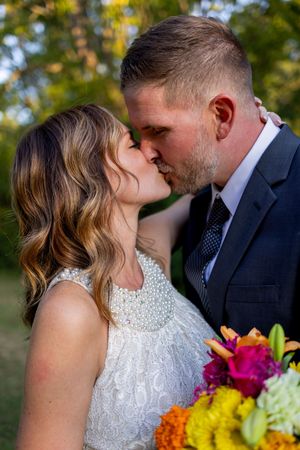 Romantic wedding sequence captured outdoors with vibrant bouquet details.