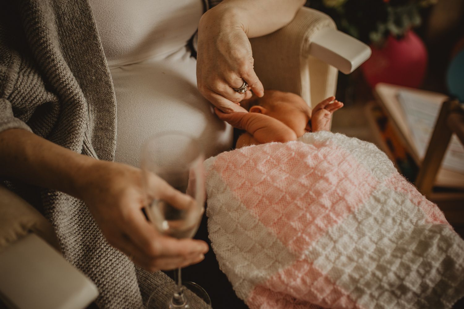 new mom holding newborn hand