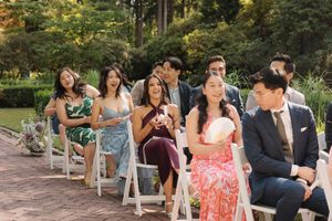 A panoramic wedding photo sequence showing couples seated outdoors on rustic wooden benches in a garden setting.
