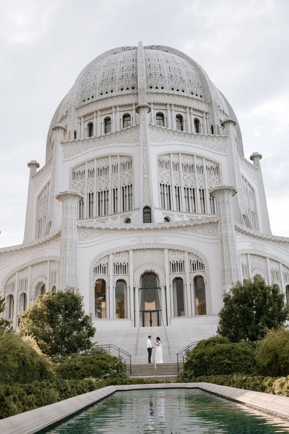 Panoramic exterior views of the Baha'i Temple in Wilmette, Illinois showing its ornate white domed architecture and pools.
