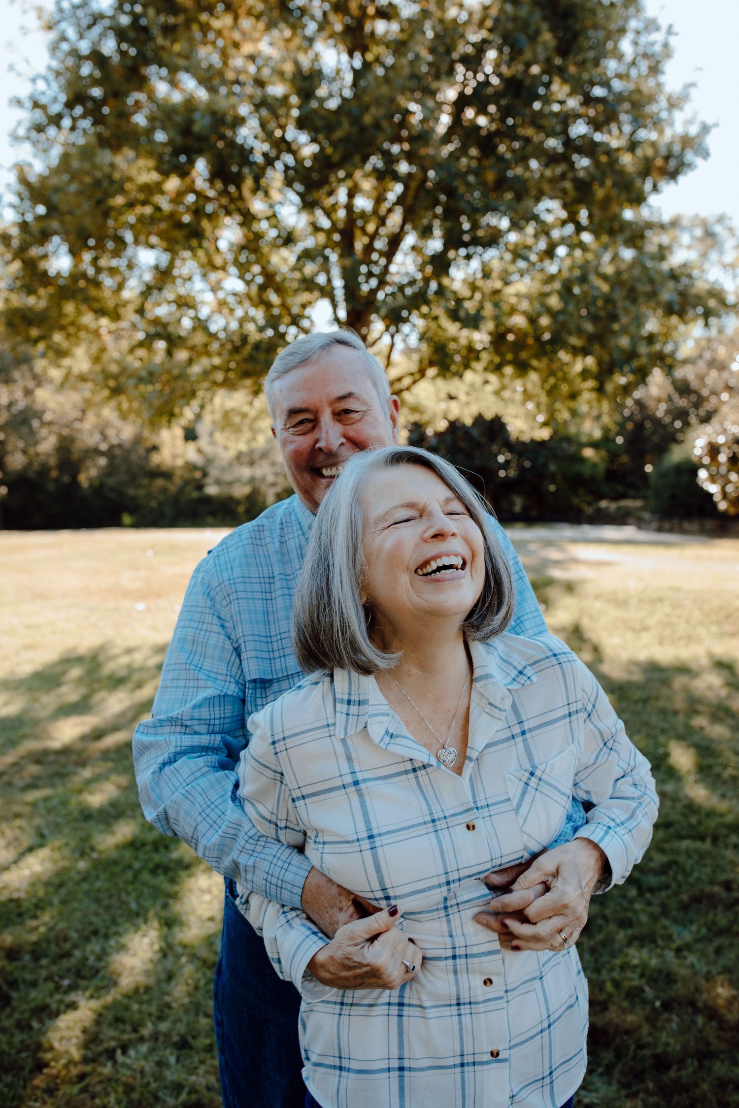Mature couple sharing a joyful moment outdoors.