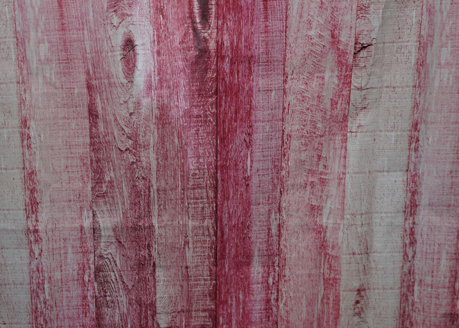 Distressed wood plank background with red and white weathered paint texture.