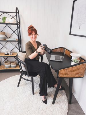 A black and rattan office chair is shown from multiple angles in a modern workspace setting with shelving and plants.