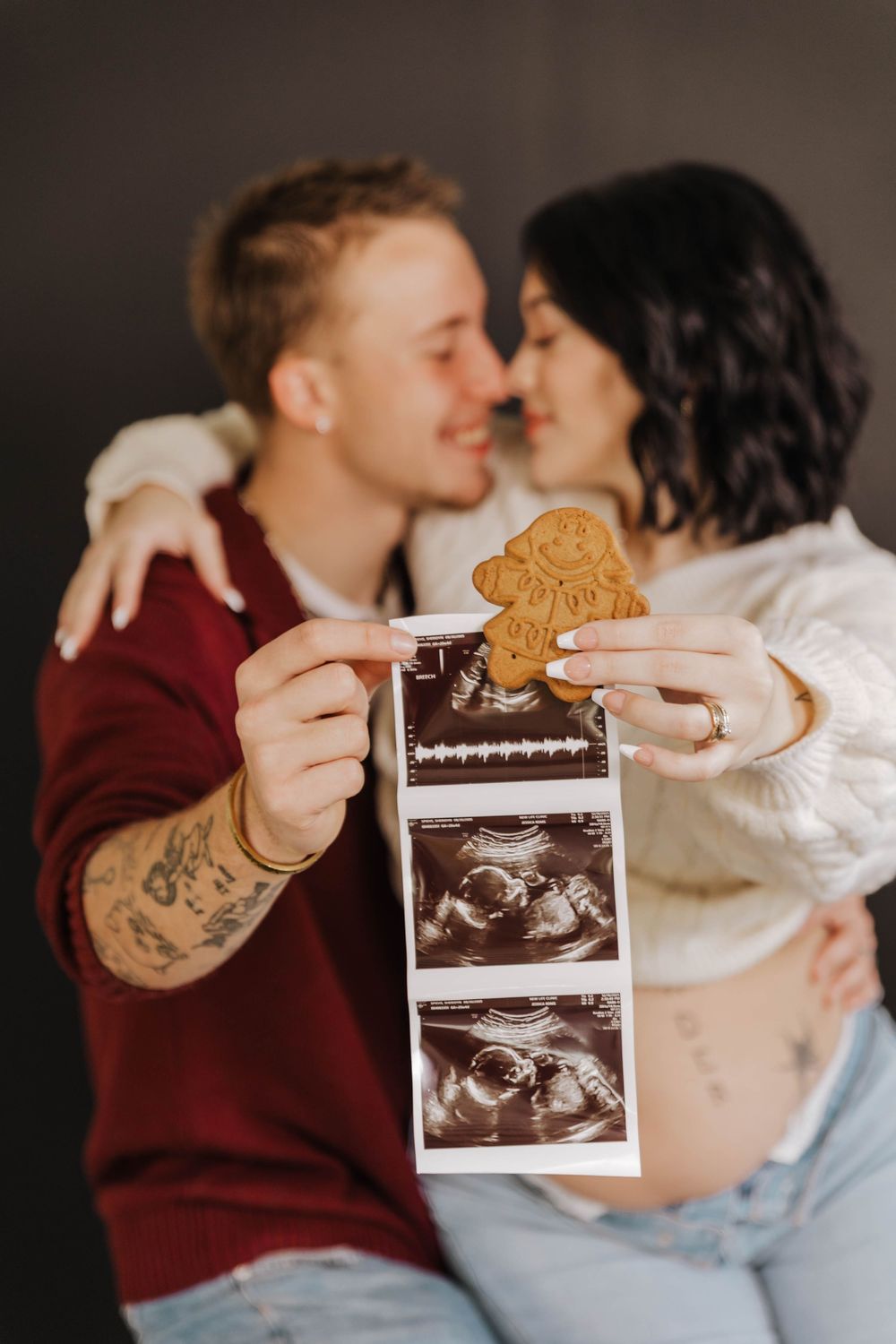 A couple shares tender moments while holding ultrasound photos, documenting their pregnancy announcement in a series of images.