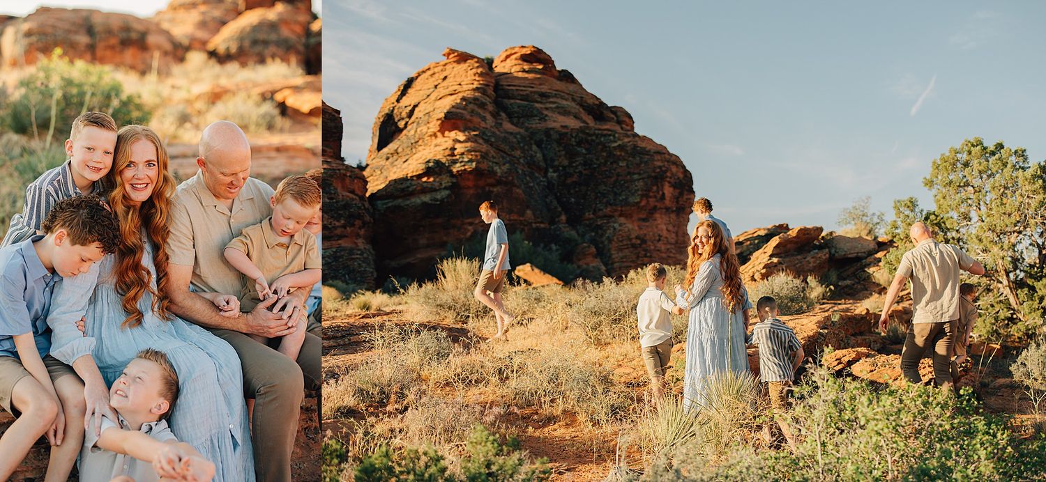Family posing on red rock formations in a desert landscape during golden hour, wearing coordinated blue and white outfits.